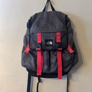 The North Face gray and pink laptop backpack.